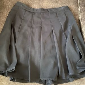 Super cute black pleated skirt, lightly used, nice material.